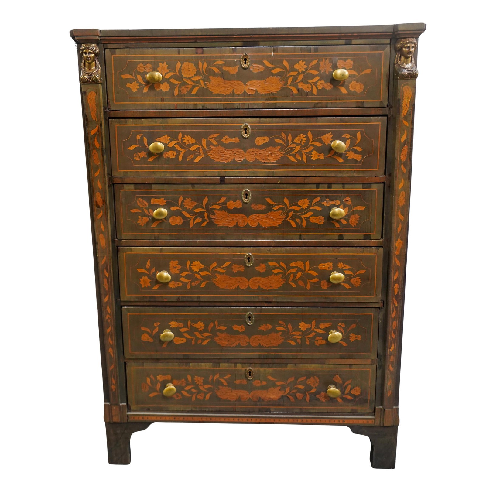 19th C. Dutch Marquetry Inlaid Dresser: DESCRIPTION: 19th Century Dutch dresser composed of a wood crafted foundation with six stacked drawers each designed with inlaid floral details and fitted with bronze keyholes, and knob pulls. Drawers