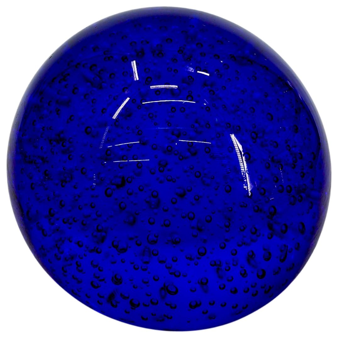 Blue Magnum Glass Paperweight: DESCRIPTION: Blue magnum glass paperweight, featuring controlled bubbles within throughout. CIRCA: 20th Century ORIGIN: Continental DIMENSIONS: H: 5.75" W: 6.5" L: 6.5" CONDITION: Good condition Unles