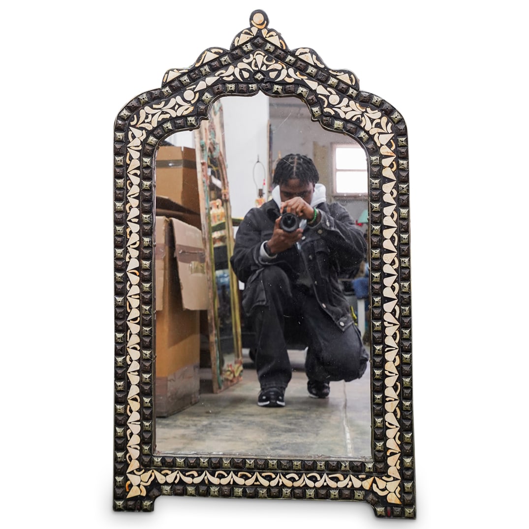 Vintage Tangier Moroccan Mirror: DESCRIPTION: Vintage tangier Moroccan mirror, featuring carved bone inlay and metal accents. CIRCA: 20th Century ORIGIN: Morocco DIMENSIONS: H: 40.5" L: 23.75" CONDITION: Normal wear consistent with a