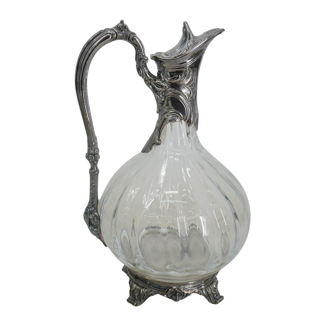 Antique French Silver-Mounted Glass Claret Jug: DESCRIPTION: Antique French silver mounted glass claret jug by Tetard Freres. Marked with Tetard Freres stamp and French silver hallmarks. CIRCA: 20th Century ORIGIN: France DIMENSIONS: H: 9 3/4" W: 6