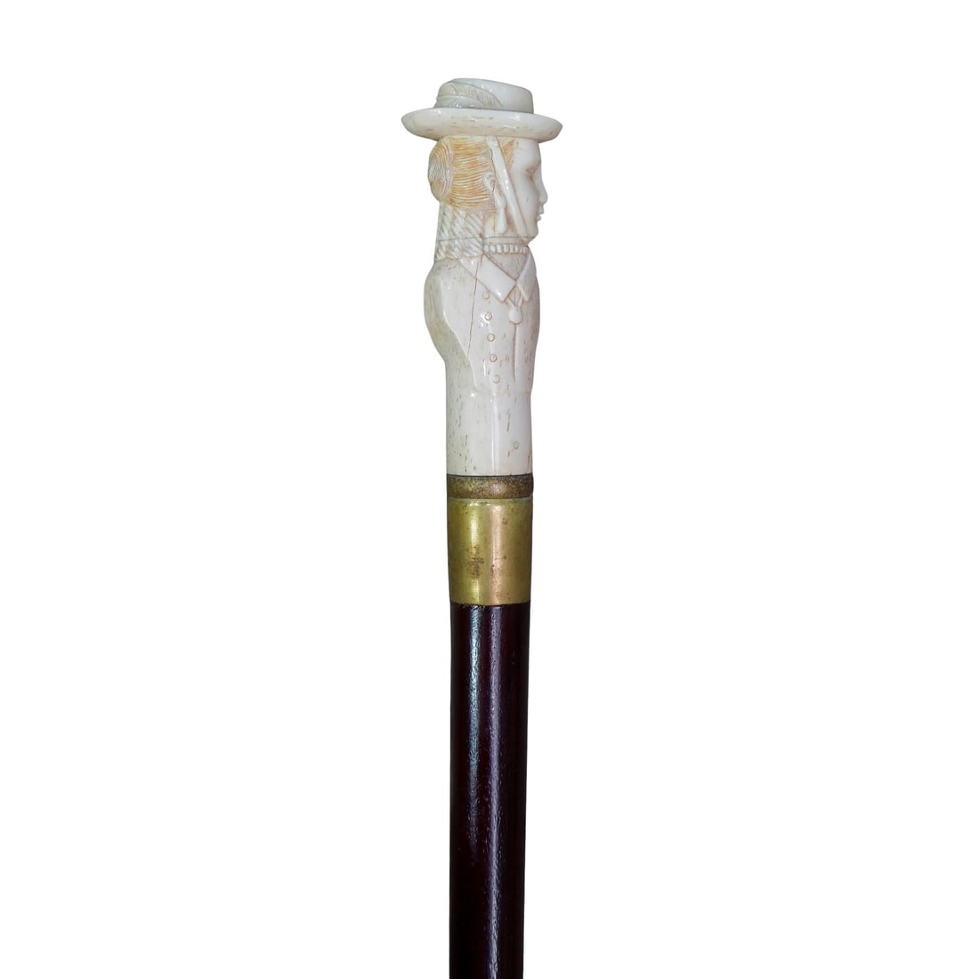 Antique Carved Bone Cane with Female Bust: DESCRIPTION: Antique lacquered wooden cane with carved bone topper depicting a female bust at profile. Topper is cracking by the ear. Cane is trimmed with gold plate metal at top and bottom. CIRCA: 19