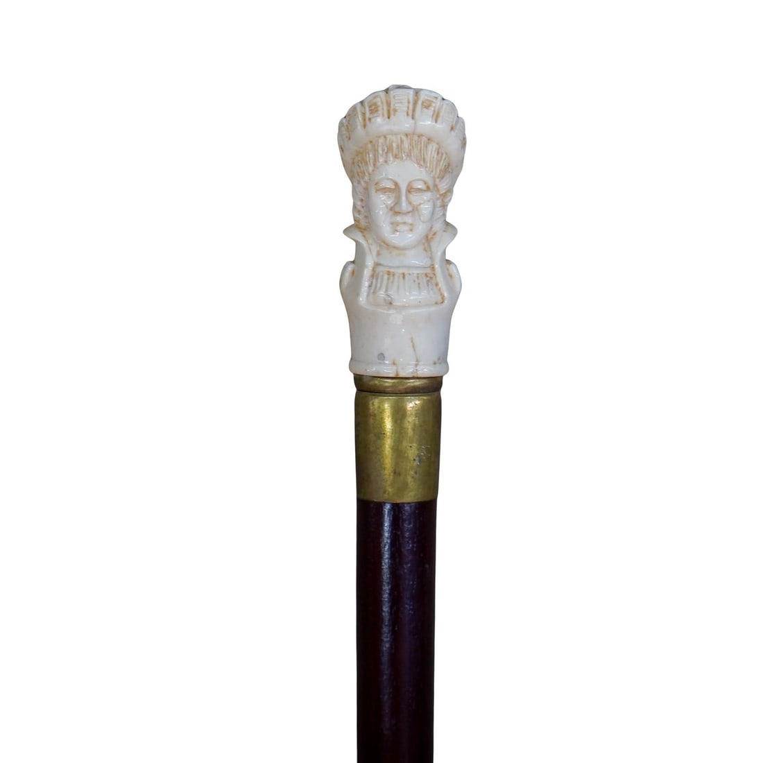 Antique Carved Bone Cane with Native American Bust: DESCRIPTION: Antique cane. Topper is carved bone and depicts a Native American bust wearing traditional headdress. Cane is wood with lacquered finish and with a gold metal fitting at top and bottom. C