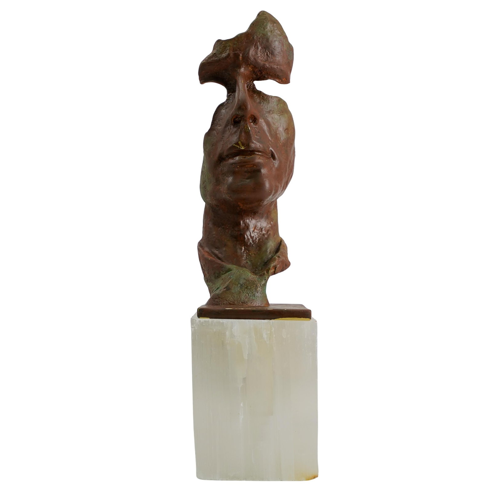 Mixed Metal Modernist Face Sculpture: DESCRIPTION: Mixed metal face sculpture with a brown painted overlay in a Salvador Dali-esque style. Sits on a base of sodalite. CIRCA: 20th century ORIGIN: Continental DIMENSIONS: H 14.5" D 3.25" CON