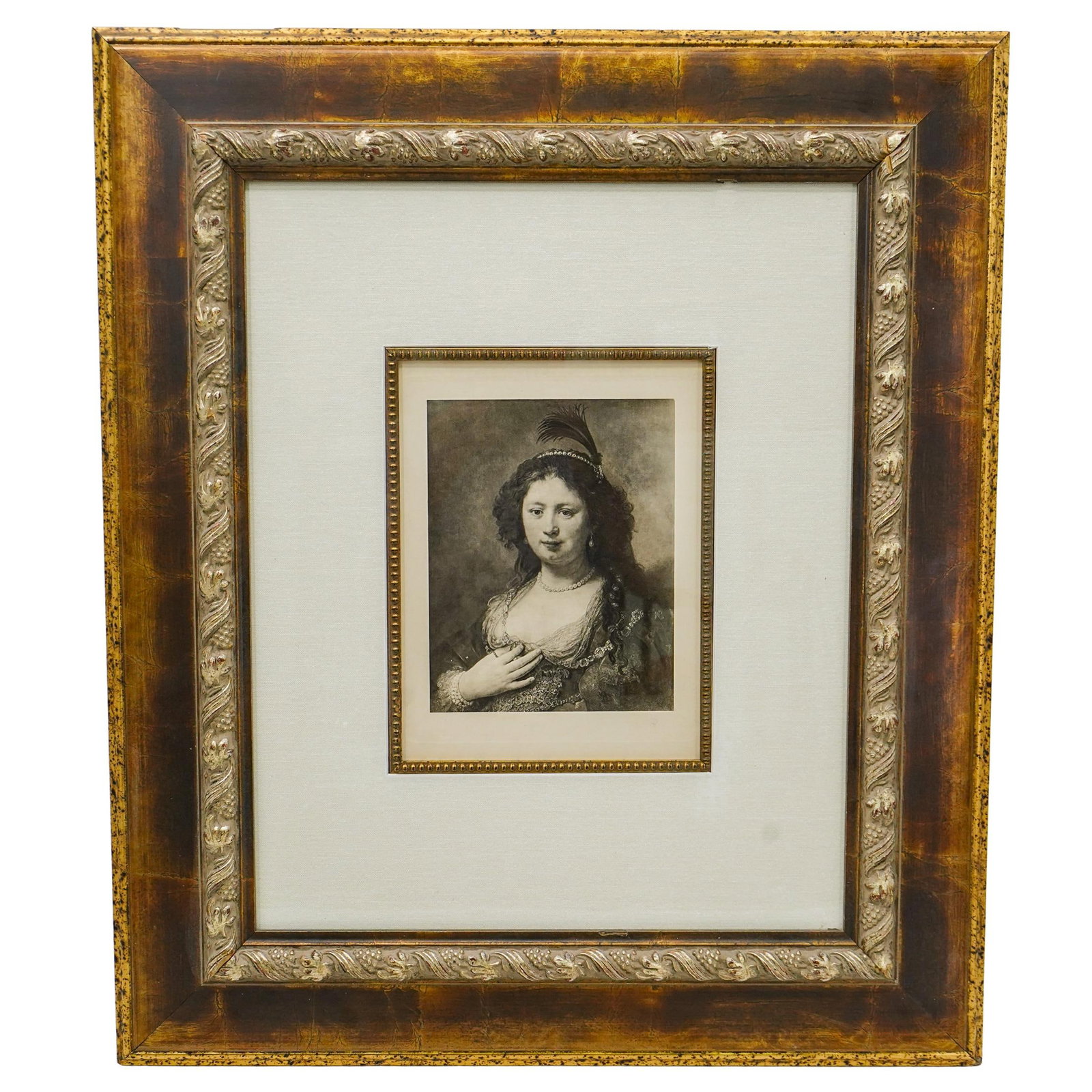 After Rembrandt Portrait of a Woman Etching: DESCRIPTION: After Rembrandt etching, portraying a noblewoman. The piece showcasing the subject's delicate expression, intricate jewelry, and luxurious gown with an elaborate feathered headpiece. This