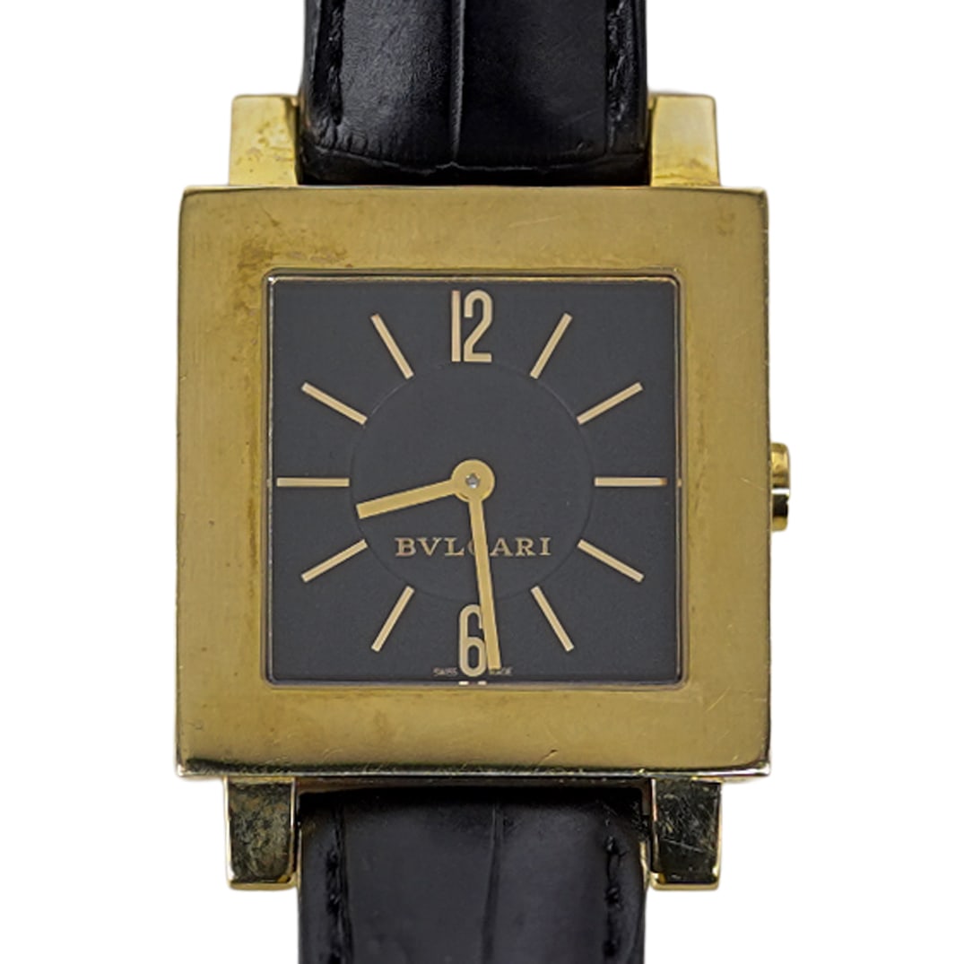 Bvlgari Quadrato 18k Gold Watch: DESCRIPTION: Bvlgari 18k yellow gold "quadrato" watch REF# SQ29GL, features a quartz movement, black dial, sapphire crystal, gold hands and markers. Attached to a reptile bracelet with gold closure. I