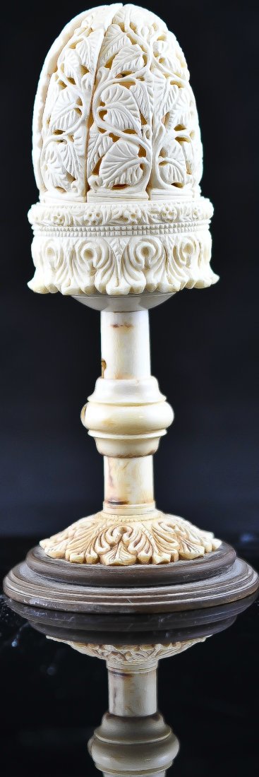 Rare Chinese Ivory mechanical blooming pill box: DESCRIPTION: Early Chinese mechanical ivory blooming pill box. Features a carved leaf design with a mechanical lever which opens up the top portion as a blooming flower exposing a small centered pill 
