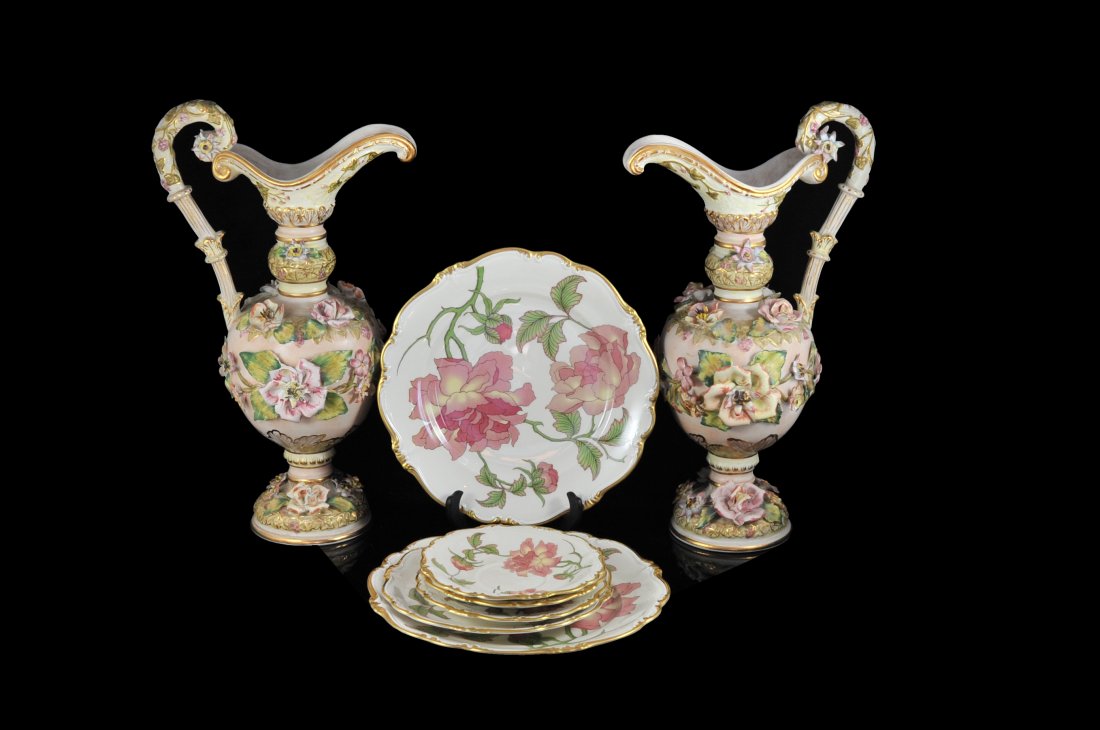 Set of six Rosenthal Rigoletto porcelain plates and: DESCRIPTION: Pair of vintage Italian porcelain floral pitchers. Slight pink ground color with heavily raised porcelain flowers and leaves adorned with gold leaf accent. Chipped in a couple of places b