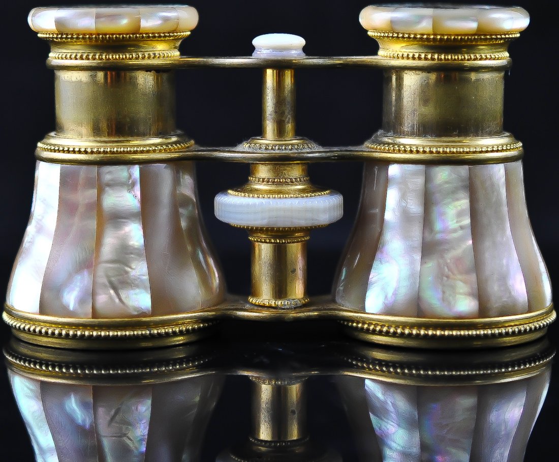 Antique French Mother of pearl and brass binocular: DESCRIPTION: French brass binoculars with mother of pearl tiles. Inlaid mother of pearl tiles around the body and the eye rims. Crystal clear lenses. Missing two small tiles. Spectacular piece CIRCA: 