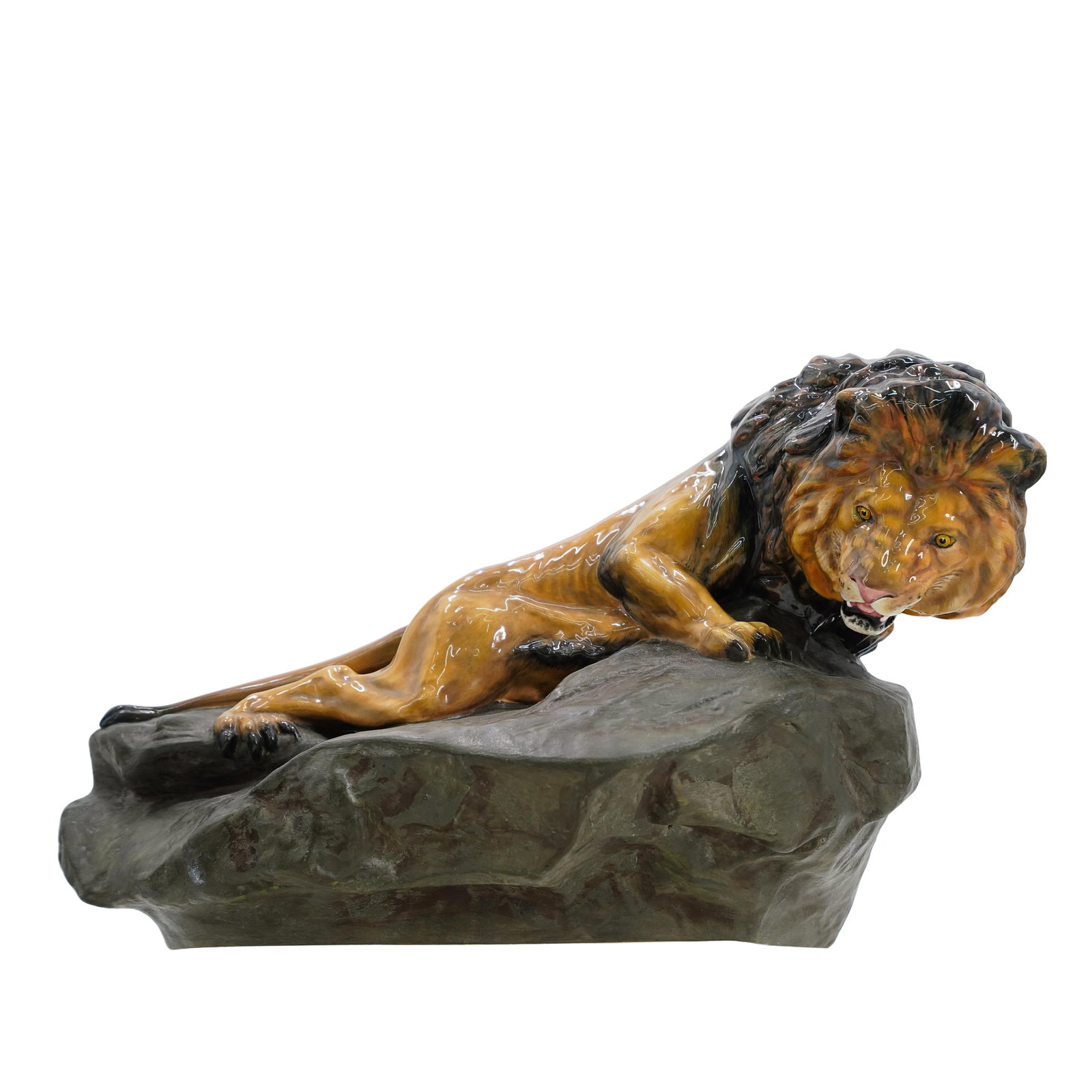 Royal Doulton Lion on a Rock Figurine: DESCRIPTION: Royal Doulton company bone China figurine of a lion resting on a rock. Glossy finish on lion, matte finish on rock. Painted realistically. Marked "made in England, Royal Doulton Bone Chin