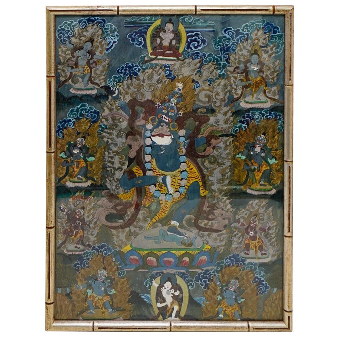 Antique Tibetan Gouache Thangka, Watercolor on Silk: DESCRIPTION: This is a Tibetan thangka painting, created using watercolor on silk. The central figure is a blue-skinned, wrathful deity. He is surrounded by flames. The deity stands in a dynamic pose,