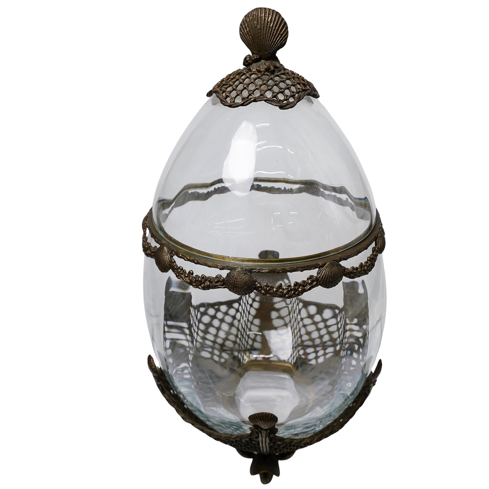 Nautical Glass Egg Vessel: DESCRIPTION: Nautical themed glass egg vessel with lid. Seashell and fishnet decoration is a brass construction. Glass component is removable from sea shell footed base. Depth 11". CIRCA: 20th century