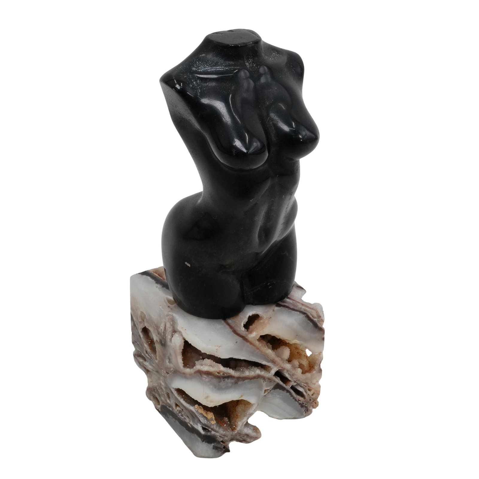 Obsidian Female Torso: DESCRIPTION: A small nude female torso figure made from obsidian. Sits on a black and white agate base with crystalized elements visible. CIRCA: 20th century ORIGIN: Continental DIMENSIONS: H: 6 1/2" 