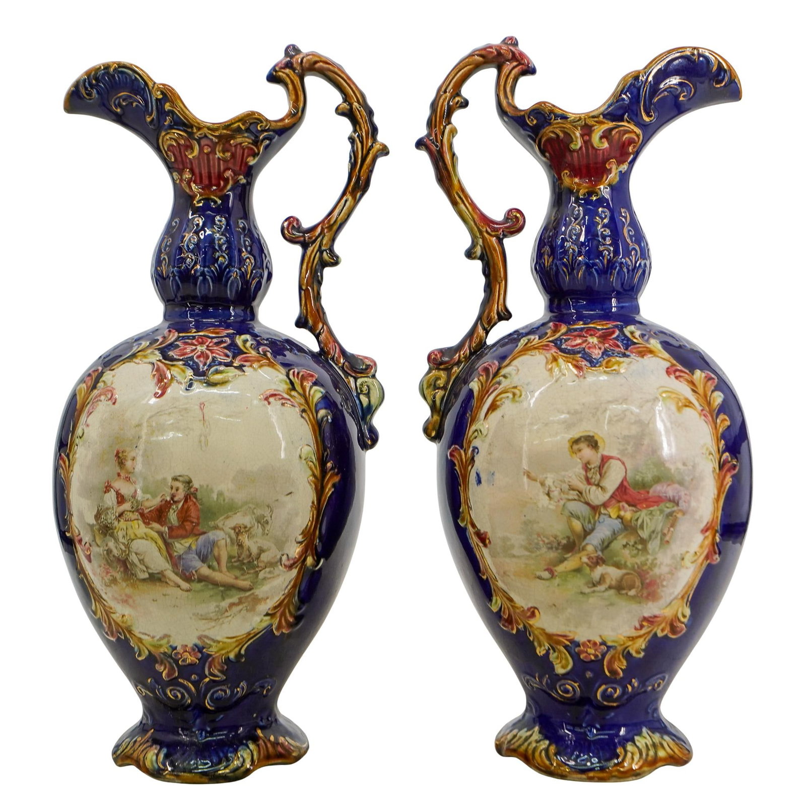 Pair of European Rococo Vases: (1) DESCRIPTION: This ewer (which is a vase-shaped pitcher or jug) probably dates to the early years of the 20th century. This ewer has the image of the boy and his dog - the boy holding perhaps a car