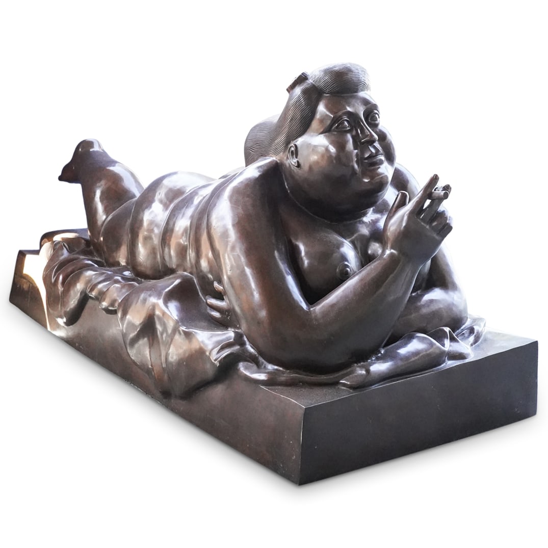 After Fernando Botero (Colombian, 1932-2023) Large Bronze Woman with Cigarette: DESCRIPTION: After Fernando Botero (Colombian, 1932-2023) Large bronze sculpture, depicting a reclining nude woman holding a cigarette, stylized after the original "Woman with Cigarette. Engraved sign