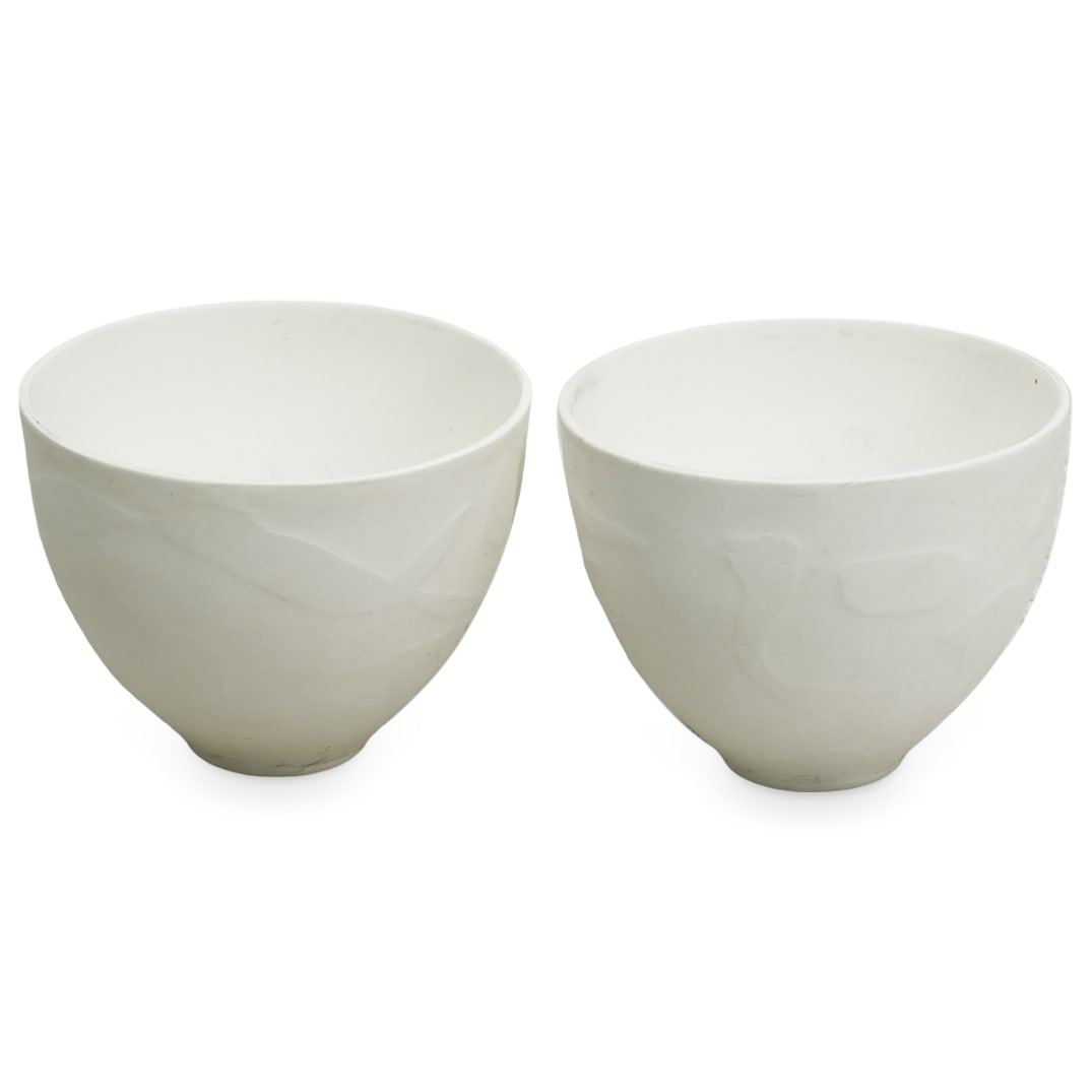 Angela Mellor (English, B. 1945) Pair of Bone China Cups: DESCRIPTION: Angela Mellor (English, B. 1945) Pair of delicate bone china cups, featuring a rounded slightly tapered form and lightly embossed designs throughout. Stamped underside. Includes original 