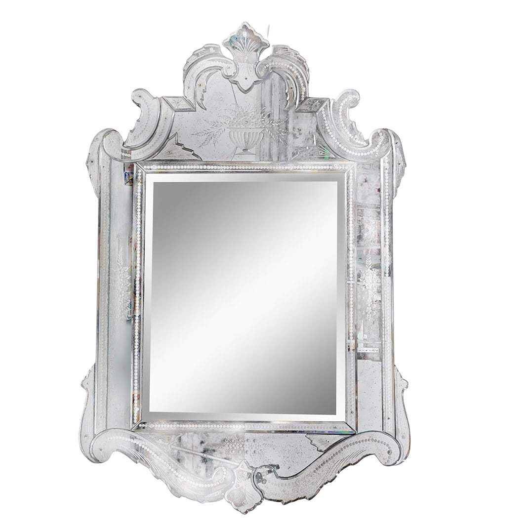 Vintage Venetian Mirror: DESCRIPTION: Vintage Venetian mirror, featuring several individual mirrored sections, shaped into graceful scrolls and flourishes, with hand etched floral and botanical motifs throughout the frame. CI