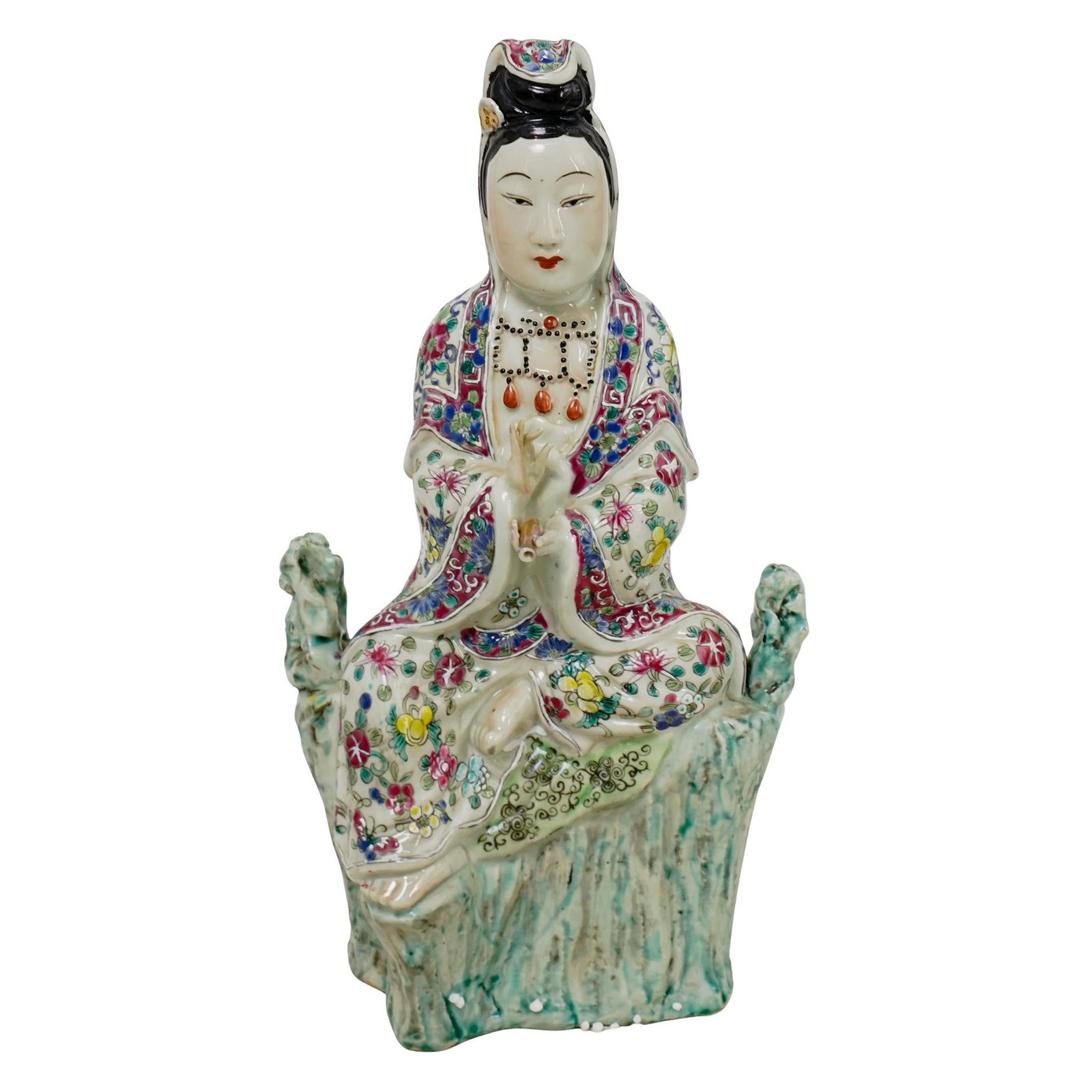 Chinese Republic Famille Rose Porcelain Guanyin Figure: DESCRIPTION: Chinese Republic period porcelain figure, depicting a seated Guanyin, decorated in famille rose pattern with intricate hand painted florals throughout. The rocky green base mimics a natur