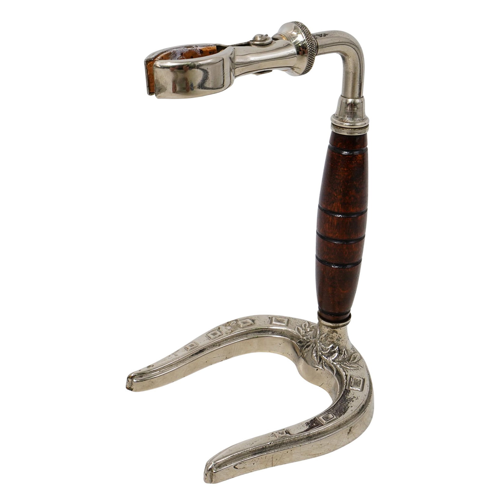 Vintage Hermes Horseshoe Wine Bottle Holder: DESCRIPTION: Vintage Hermes horseshoe wine bottle holder, depicting a metal bottle clasp, and a base designed with a horseshoe shape, finished with a wooden body. Marked "Hermes Paris". CIRCA: 20th Ce