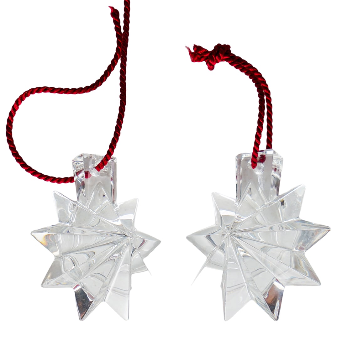 (2 Pc) Baccarat Christmas Noel Star Crystal Snowflake: DESCRIPTION: (2 Pc) Baccarat Christmas Noel Star Crystal Snowflake. In clear crystal. This set includes: two (2) stars decorations. Marked with Baccarat hallmark. Includes the original box. CIRCA: 20t