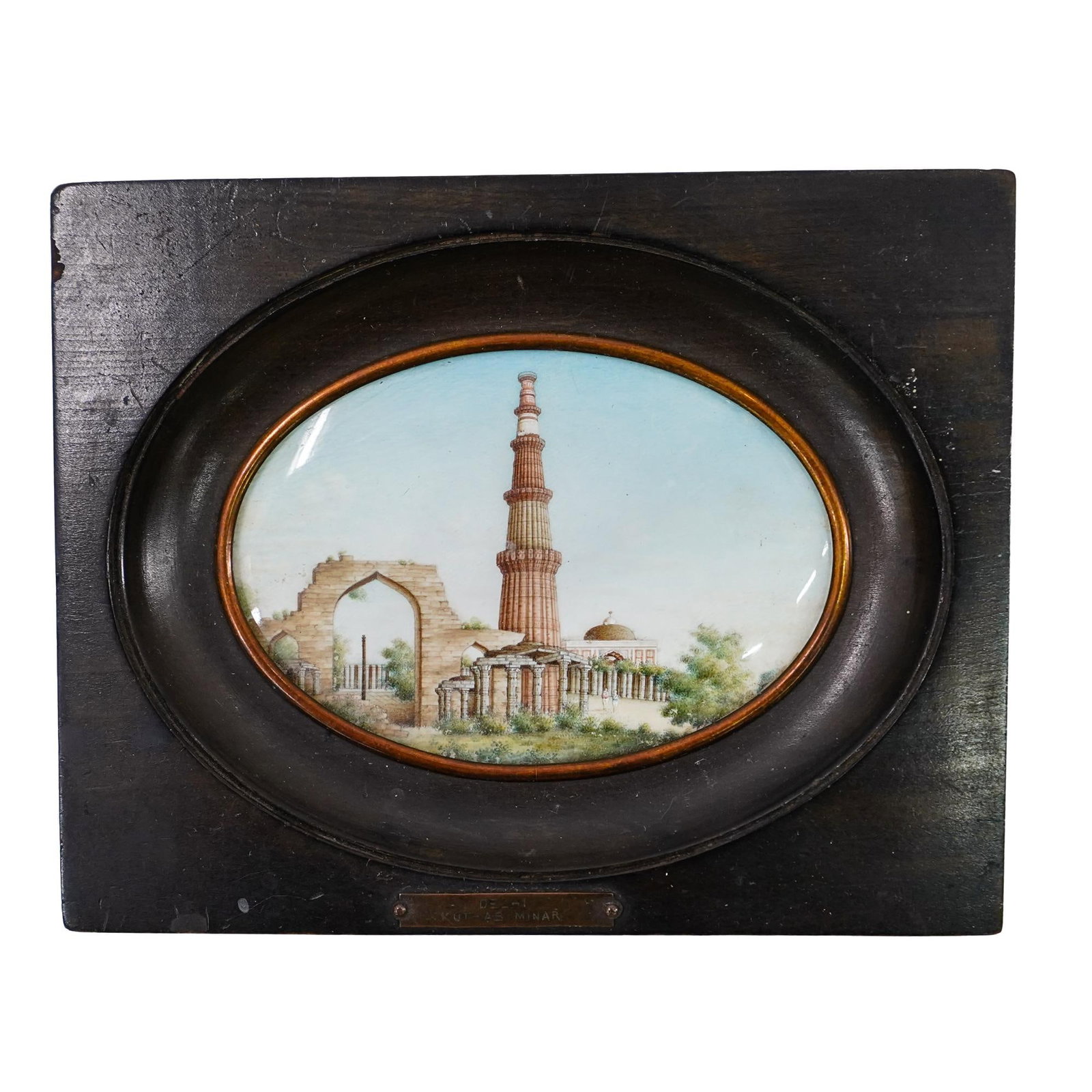 19th C. Miniature Enameled Bone Painting of the Qutub Minar: DESCRIPTION: Miniature enameled bone painting depicting the Qutab Minar monument in New Delhi, India. Marked "Delhi, Kut-Ab Minar" on bottom. Simple wood frame with brass border around painting. CIRCA