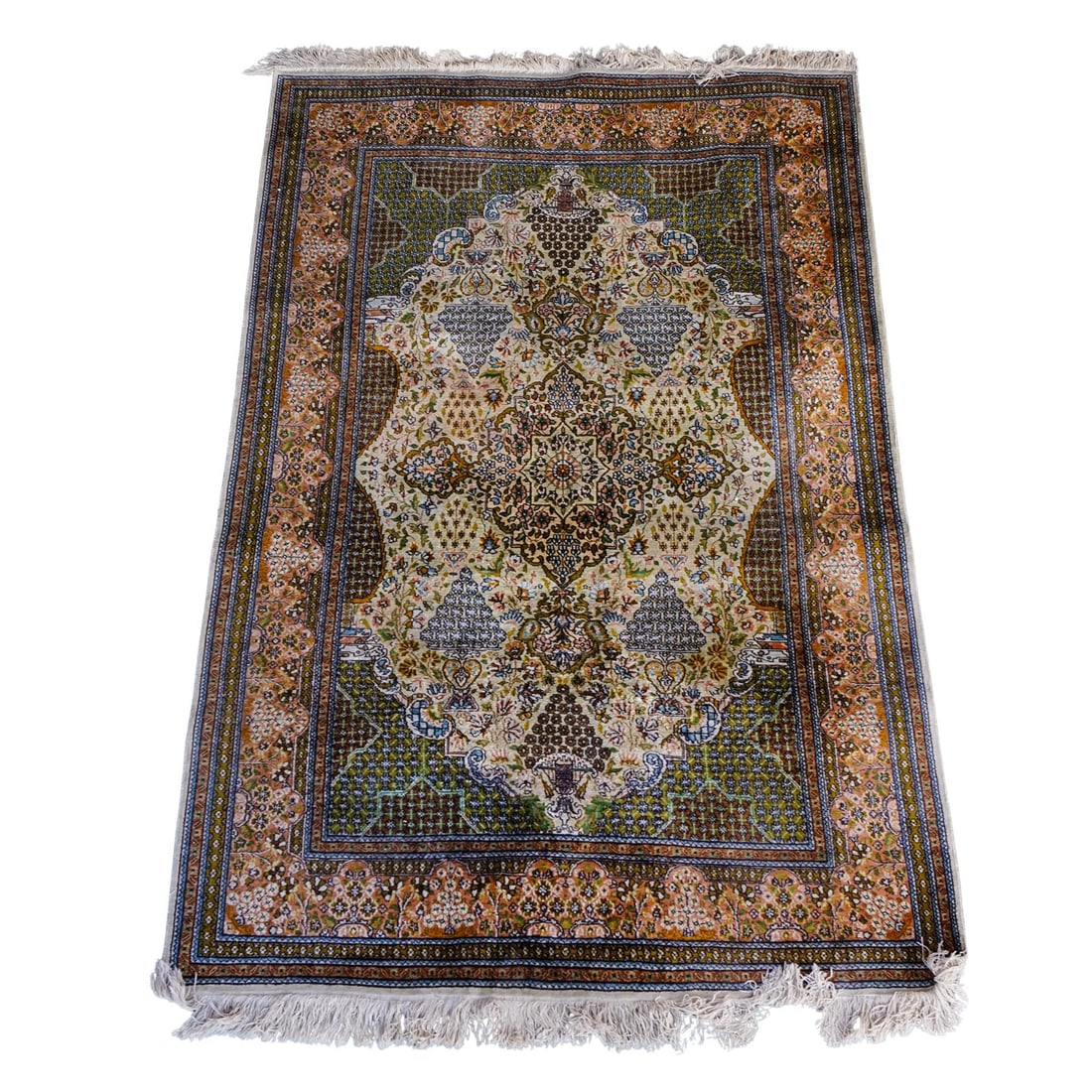 Persian Wool Area Rug: DESCRIPTION: Persian wool area rug featuring green, pinks, and cream tassels. Tassels are worn. Cicek flower motifs accompanying larger "hayat agaci" or tree of life motifs. CIRCA: early to mid 20th c
