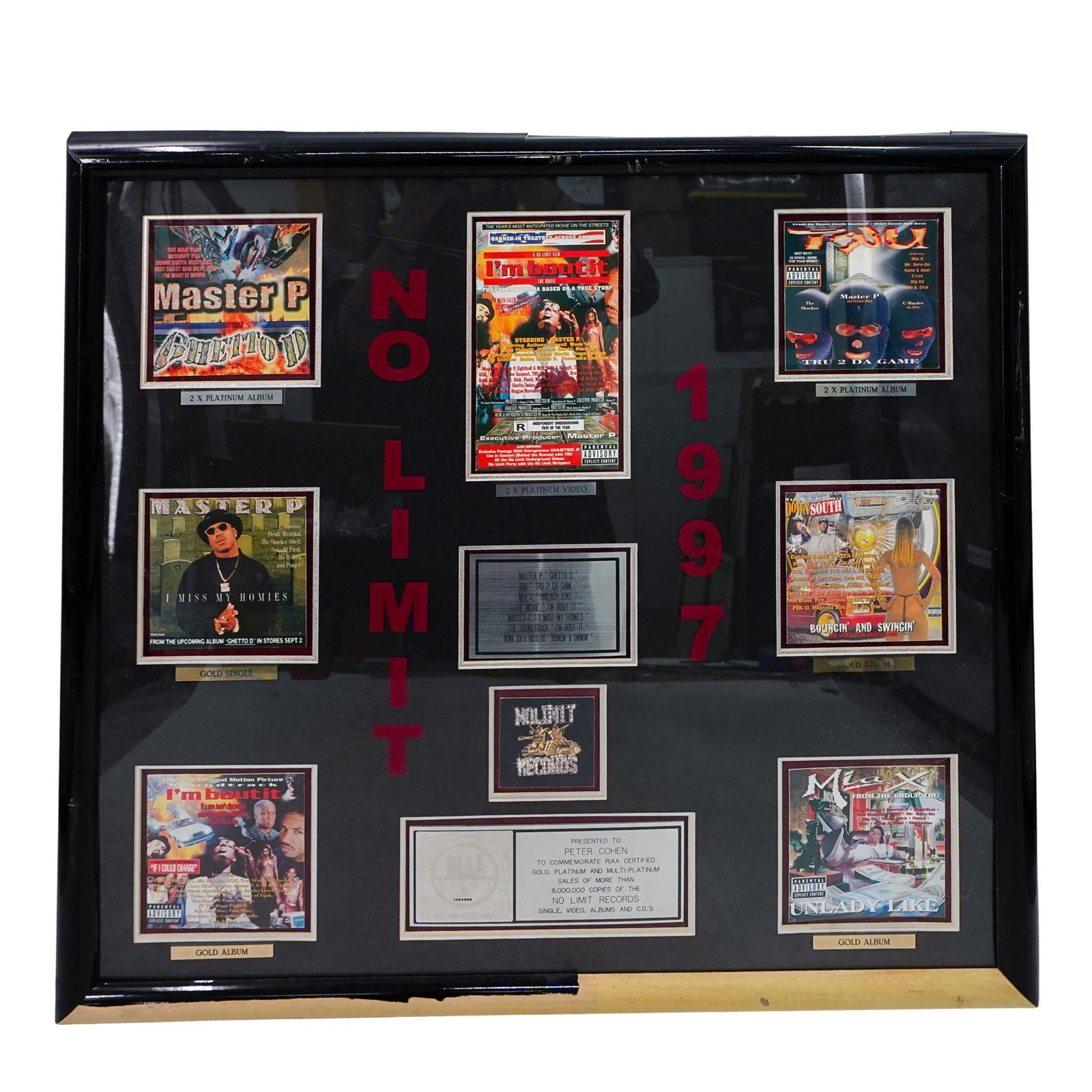 1997 No Limit RIIA Sales Records Award: DESCRIPTION: 1997 'No Limit' Sales Records Award. Presented on a display frame. Presented to commemorate the Gold and Platinum Sale Award for more than 8,000,000 copies sold. RIAA Award. Very rare mul