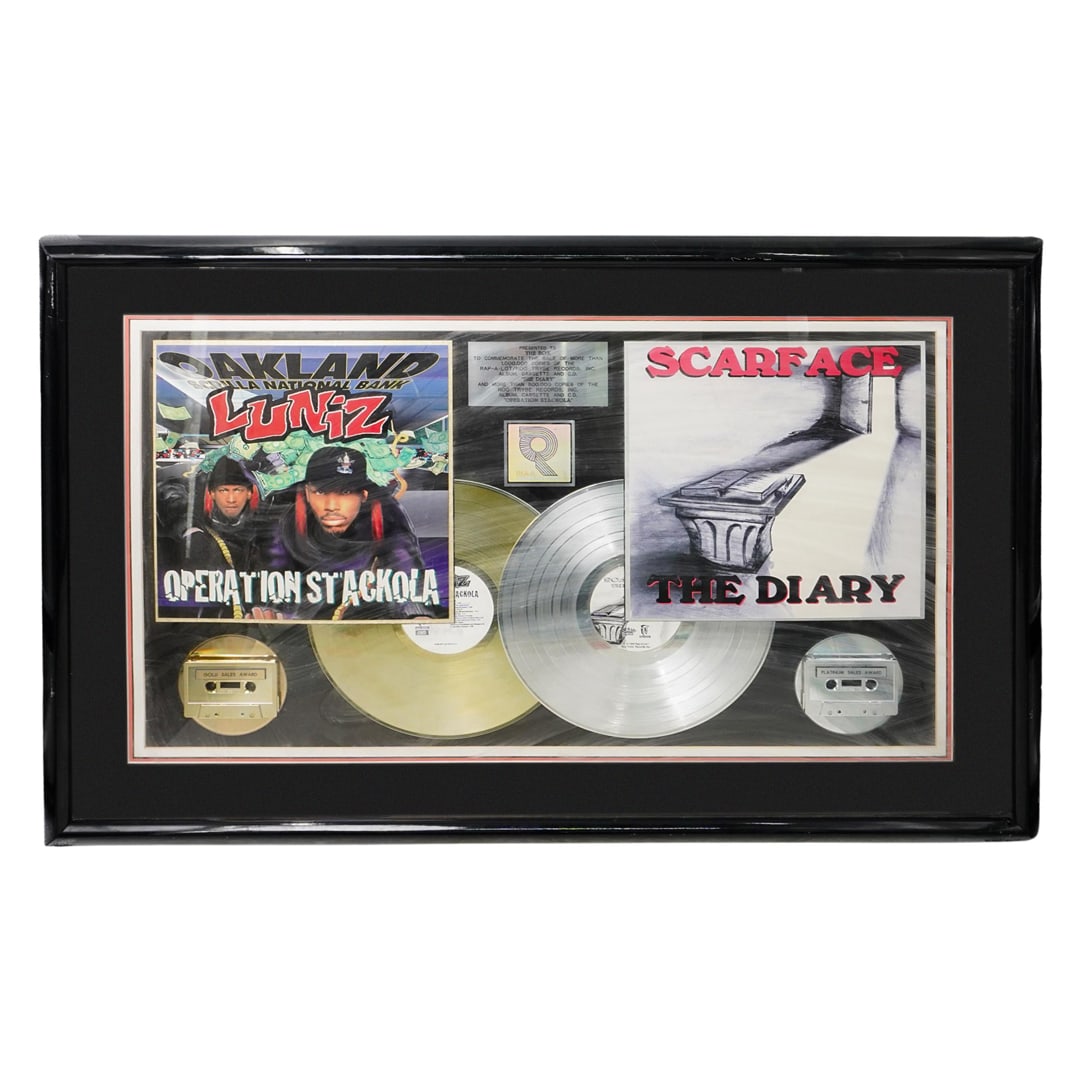 Scarface 'The Diary' Band Sales Record Award: DESCRIPTION: Scarface 'The Diary' Band Sales Record Award. Presented on a display frame. Presented to The Box. to commemorate the Platinum Sale Award for more than 1,000,000 copies of the Rap-A-Lot/NO