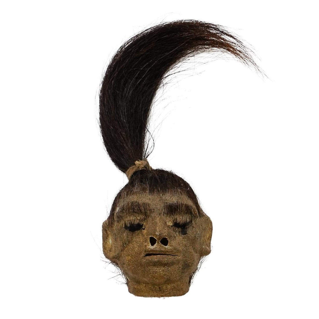 Animal Hide Replica Of A Shrunken Head W/ Hair: DESCRIPTION: 20th century animal hide replica of a shrunken head with hair. These shrunken head replicas are made from real tanned Alpaca hide and hair. The heads are hand crafted by local artisans in