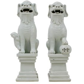 Pair of Chinese Blanc De Chine Porcelain Foo Dogs