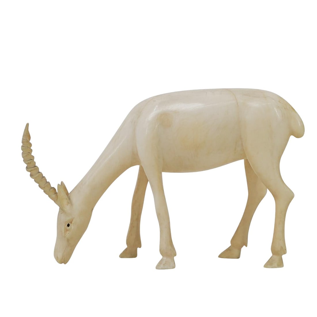 Antique African Carved Bone Gazelle Figurine: DESCRIPTION: Carved bone figurine of a gazelle. Provenance: Mr and Ms Castaldi, private Brooklyn estate. CIRCA: Late 19th early 20th century ORIGIN: Africa DIMENSIONS: H: 2 5/8" W: 1" L: 3 1/2" CONDIT