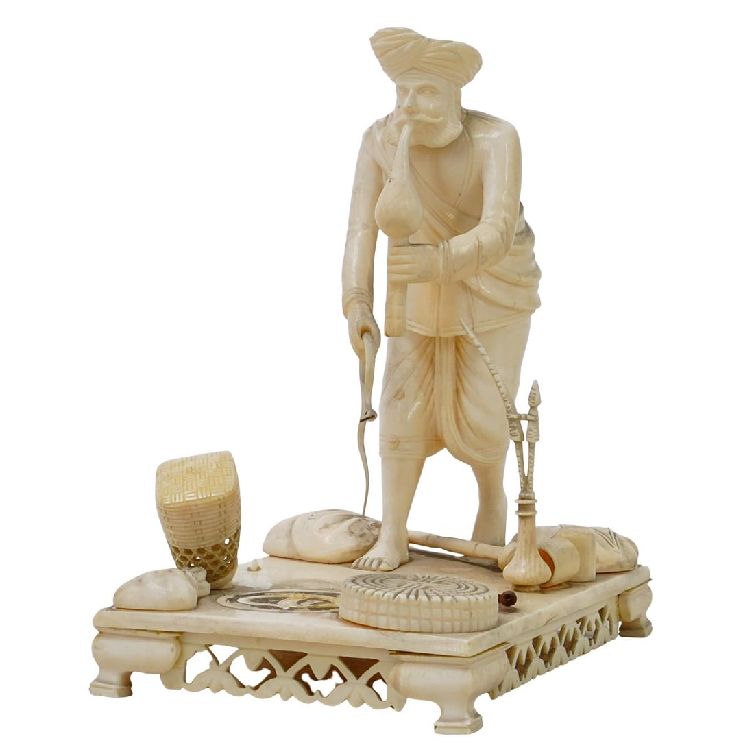 19th Century Carved Bone Snake Charmer Figurine: DESCRIPTION: 19th century carved bone figurine, featuring a male snake charmer figure and three snakes in different colors. Footed base. Provenance: Mr and Ms Castaldi, private Brooklyn estate. CIRCA: