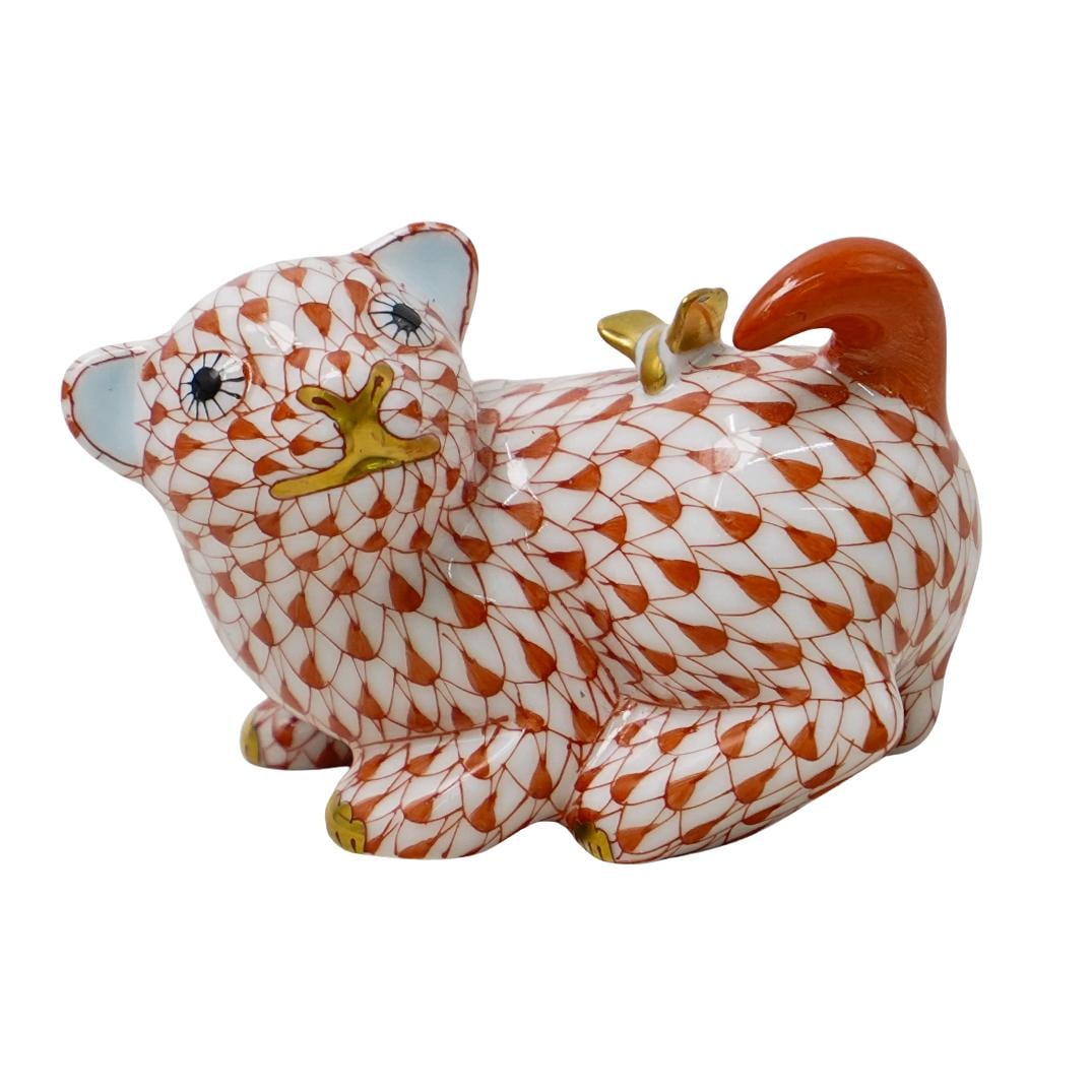 Herend Porcelain "Puppy W/ Butterfly" Rust Fishnet Figurine: DESCRIPTION: Herend porcelain "Puppy with butterfly" rust fishnet figurine. Model: 15852. Marled with Herend hallmarks on the underside. CIRCA: 2006 ORIGIN: Hungary DIMENSIONS: H: 2" W: 2 1/2" CONDITI