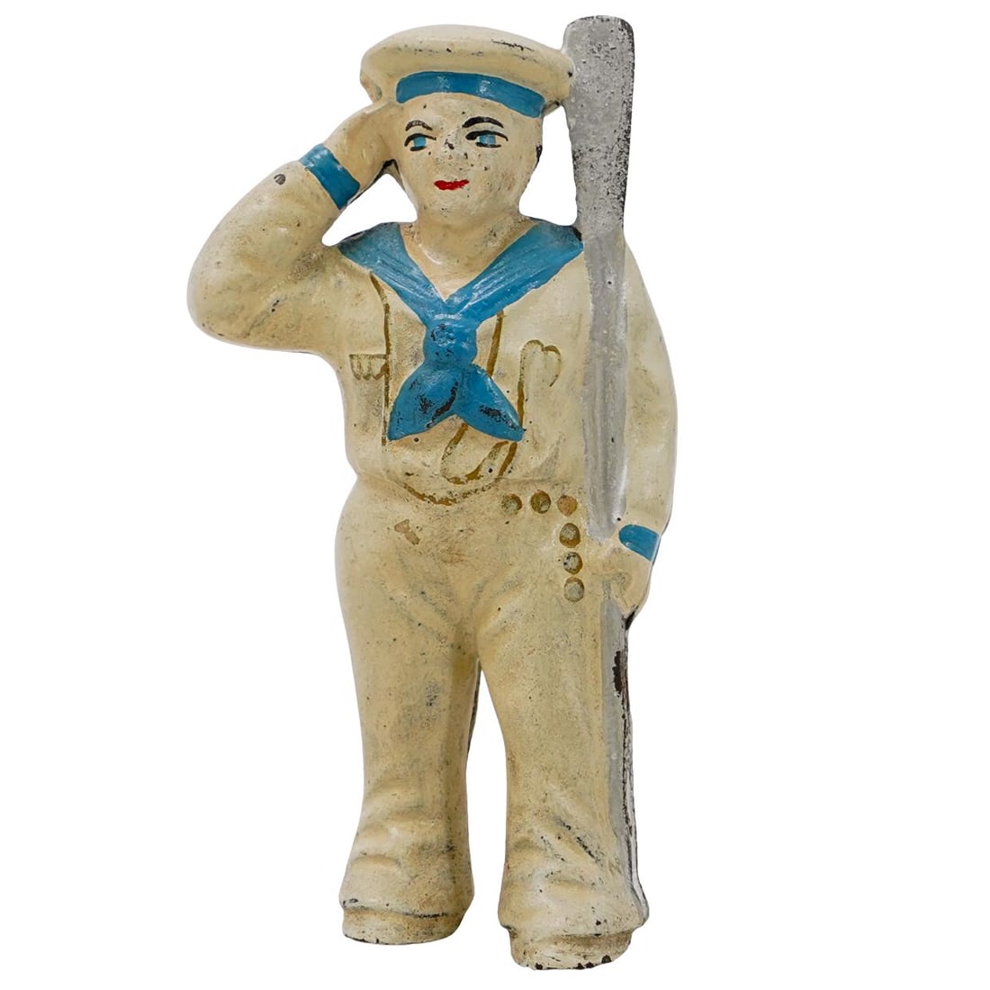 Antique Cast Iron Sailor Coin Bank: DESCRIPTION: The figurine depicts a sailor dressed in a traditional navy uniform, including a white cap with a blue band, a blue neckerchief, and white trousers. The sailor is saluting with his right 
