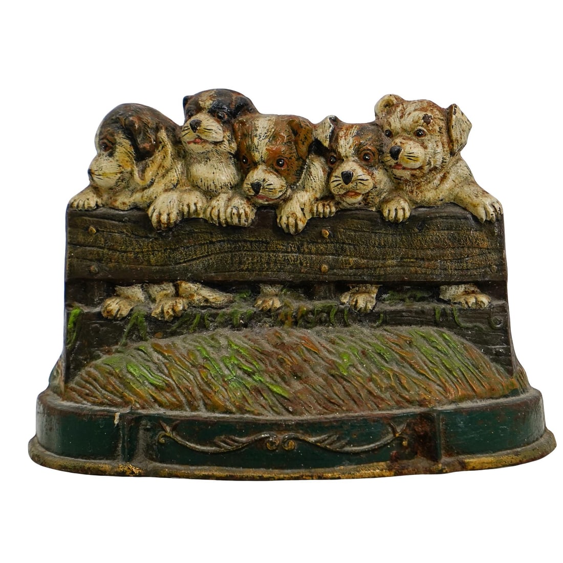 Cast-Iron Puppies Door Stop: DESCRIPTION: Cast-iron doorstop featuring painted puppies peeking over a fence. CIRCA: 20th century ORIGIN: United States DIMENSIONS: H: 9 1/2" W: 3 1/2" L: 12" CONDITION: Great Unless otherwise state