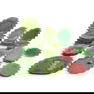 (36 Pc) Bordallo Pinheiro Majolica Ceramic Dish Collection: DESCRIPTION: This is a collection of Majolica ceramic plates and serving dishes featuring detailed relief work and nature-inspired themes. The collection includes green-glazed ceramics and a few pink-