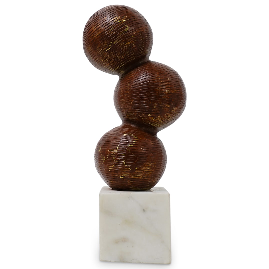 Modernist Ceramic Sphere Sculpture: DESCRIPTION: This sculpture consists of three stacked ceramic spheres on a square marble base. The spheres, each with a textured surface, are brown with hints of gold and are stacked vertically, sligh