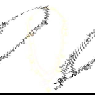 Chanel CC Chain Belt: DESCRIPTION: Chanel light gilded metal chain belt entwined with light purple fabric and adorned with faux pearls and enameled charms. Complete with Chanel box. CIRCA: 2004-2007 ORIGIN: France DIMENSIO