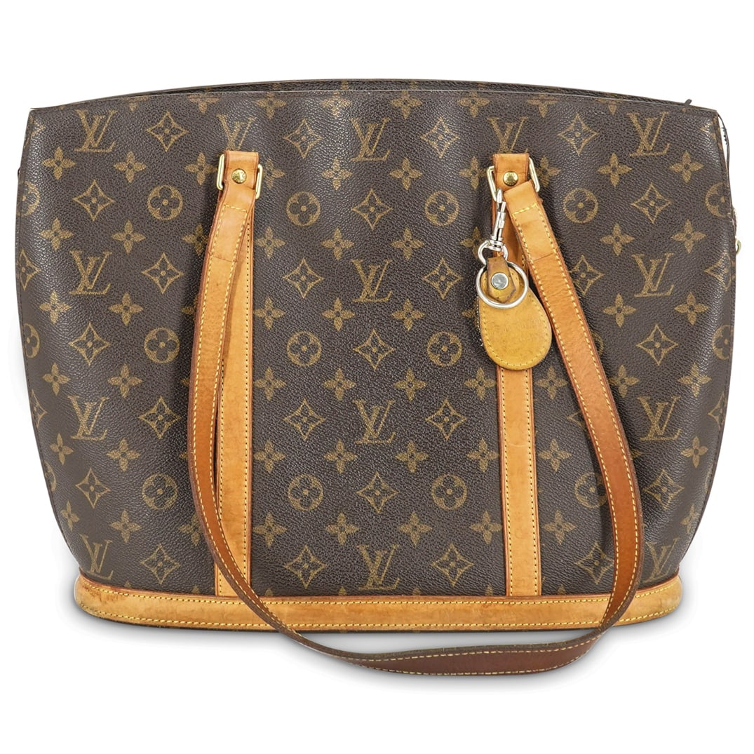 Louis Vuitton Babylone Tote Bag: DESCRIPTION: A Louis Vuitton Babylone tote shoulder bag, with Louis Vuitton marked studs at base of strap and "Louis Vuitton Paris Made in France" stamped into interior zipper pocket leather. CIRCA: L