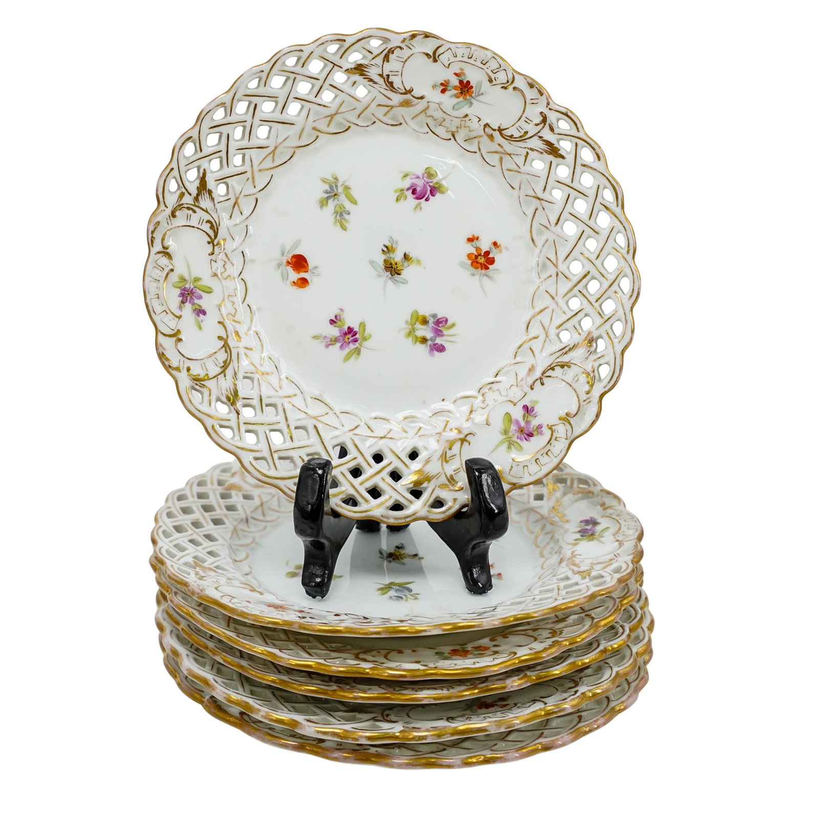 (6 Pc) Antique Dresden Porcelain Service Plates: DESCRIPTION: Dresden porcelain plates with an openwork lattice border adorned with delicate hand-painted floral motifs and gold accents. The center of each plate showcases a finely detailed floral des
