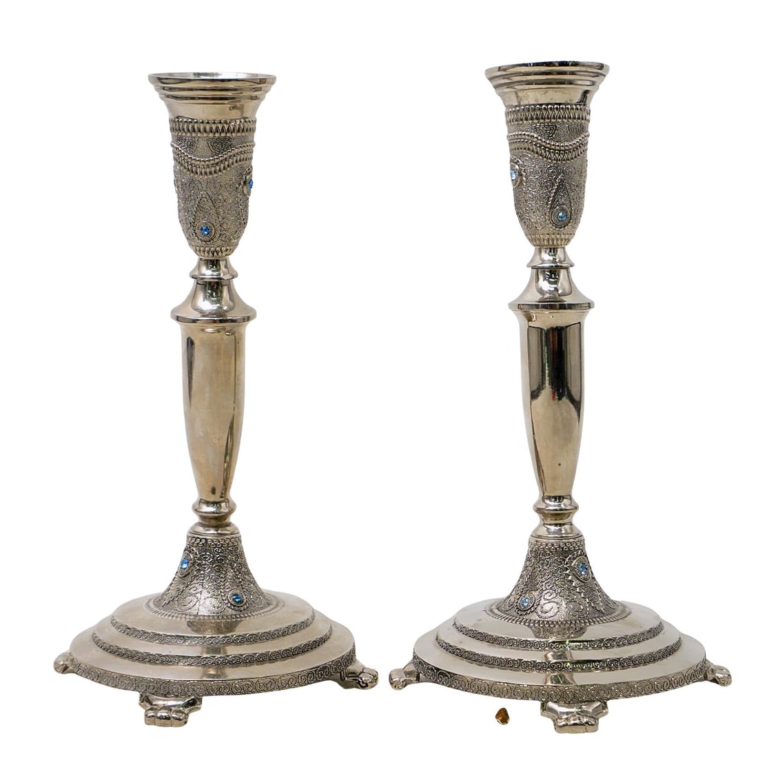 Pair Of Judaica Silverplate Candle Sticks: Pair Of Judaica Silverplate Candle Sticks Pair of Judaica silverplate candle sticks, embellished with filigree designs and applied light blue accent crystals. H: 9 1/2" W: 5"
