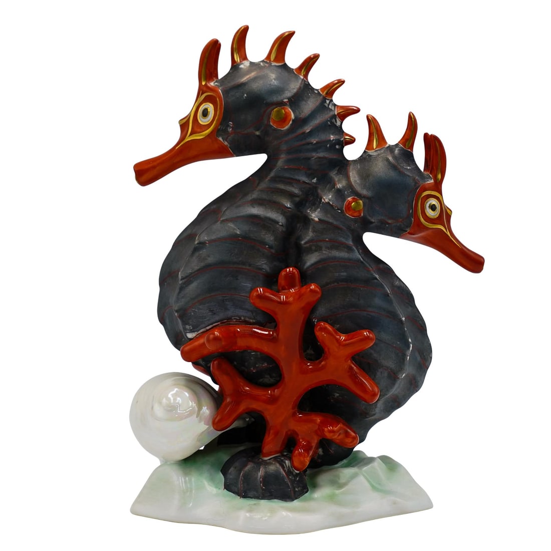 Herend Pair Of Seahorses Porcleain Figurine: Herend Pair Of Seahorses Porcleain Figurine 1946, Hungary Herend porcelain figurine, depicting a pair of dark colored seahorses with orange and gilt accented trims. Small red coral and an iridescent s