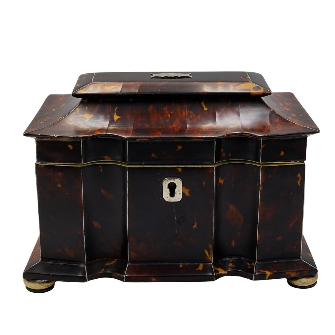 Antique English Tortoise Hued Tea Caddy: Antique English Tortoise Hued Tea Caddy1810s to 1830s, EnglandAntique English tea caddy, featuring a tortoise hued veneer with carved bone trim. The caddy has a serpentine front and pagoda top lid, an