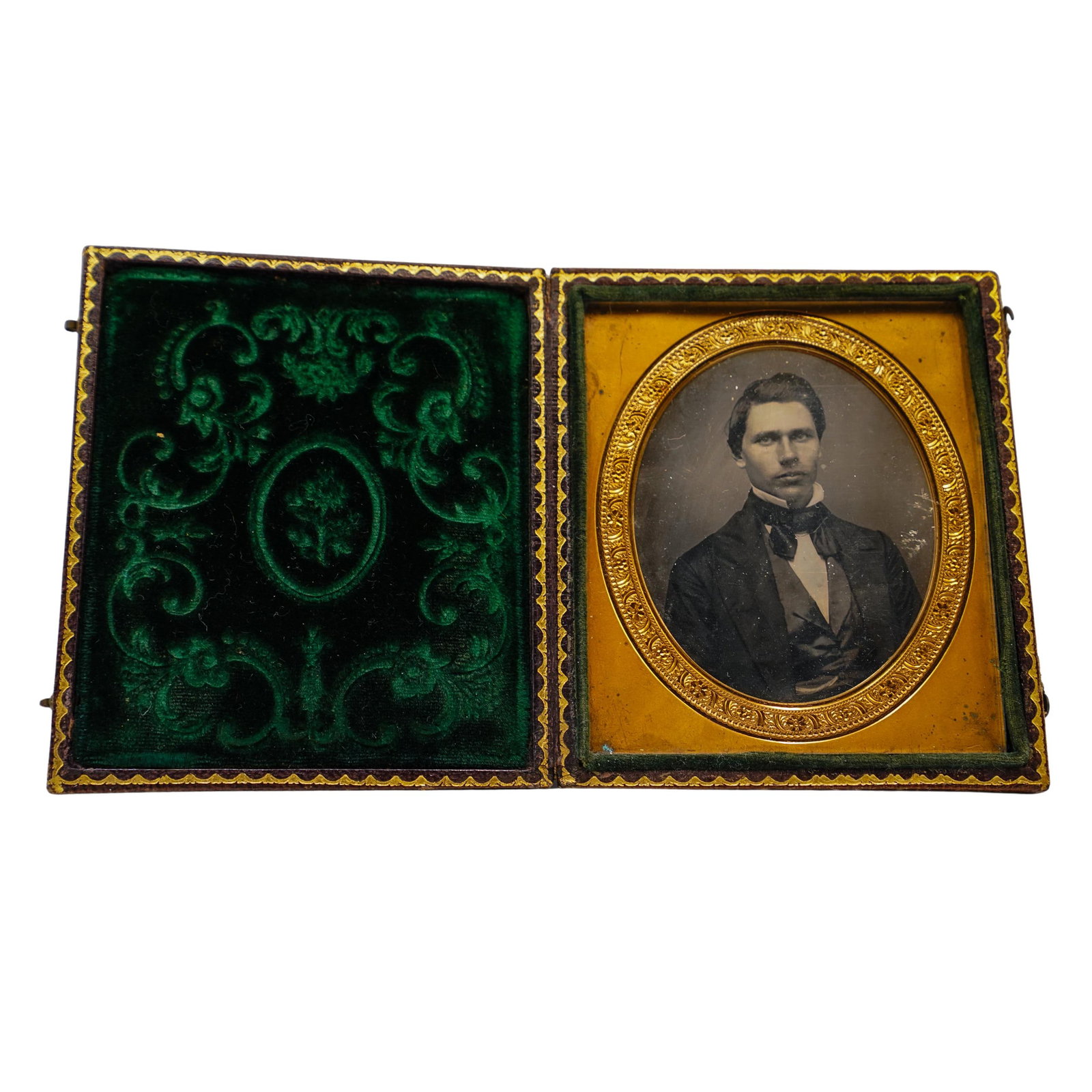 Antique Daguerreotype Photograph In Leather Case: Antique Daguerreotype Photograph In Leather Case1840s to 1850s, USAAntique daguerreotype photograph, depicting a formally dressed young man, wearing a high collared white shirt, dark cravat, waistcoat