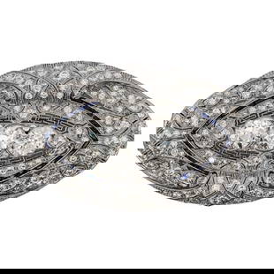Art Deco Platinum Diamond and Sapphire Brooch: Art Deco Platinum Diamond and Sapphire BroochEarly 20th Century, USAArt Deco platinum brooch, encrusted with diamonds and accented with calibre cut sapphires. The focal point features three large roun