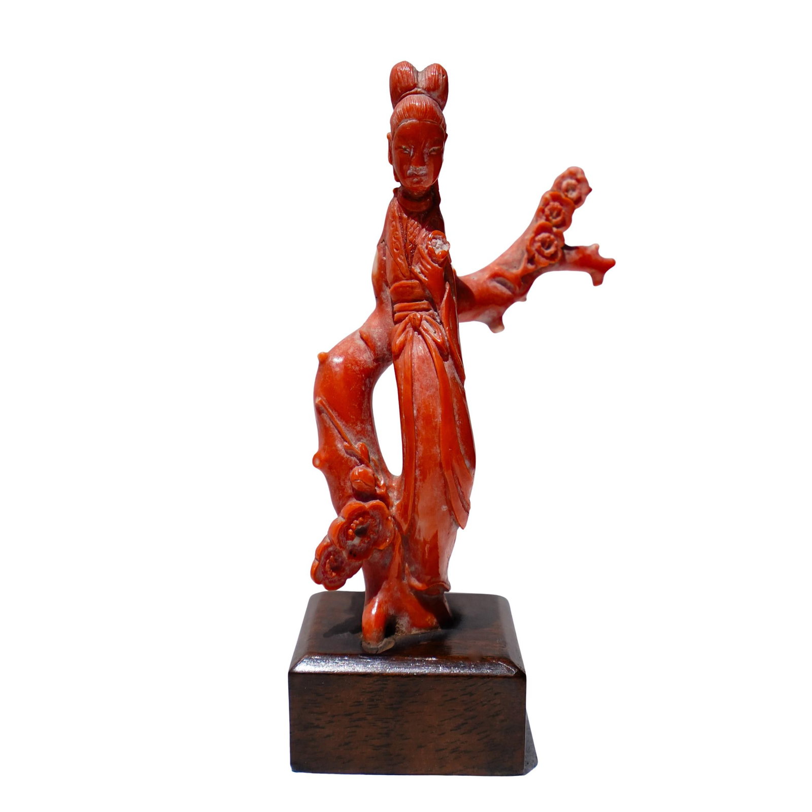 Chinese Carved Coral Figurine On Wood Stand: Chinese Carved Coral Figurine On Wood Stand Early 20th Cent, China A Chinese carved coral figure of a woman holding flowers, mounted on a dark wooden base. The coral is a vibrant reddish-orange color,