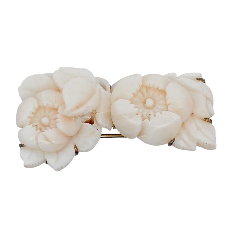 Sterling Silver and Carved Angel Skin Coral Brooch: Sterling Silver and Carved Angel Skin Coral Brooch Mid 20th Century, Continental Sterling silver and angel skin coral brooch, featuring carved twin peony style flowers. Hallmarked "Sterling"