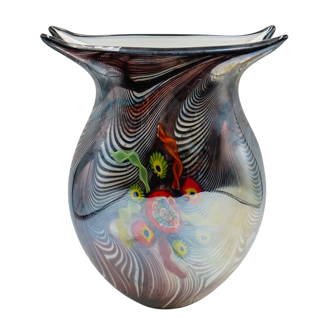 Murano Glass Vase: Murano Glass Vase 20th century, Italy Murano glass vase featuring a black and white swirl design with brightly colored floral accents. Rectangular, wide vase mouth. H 10 1/4" L (mouth) 7 5/8"