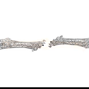 Art Deco Platinum and Diamond Bar Brooch: Art Deco Platinum and Diamond Bar Brooch1920s to 1930s, ContinentalArt Deco platinum bar brooch, featuring a central bezel set round brilliant cut diamond (approx. 1 carat), with multiple smaller diam
