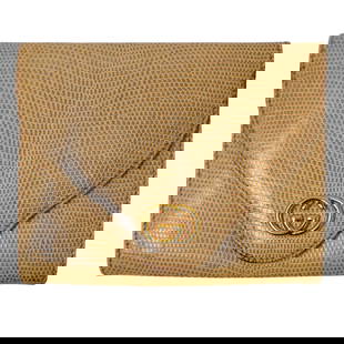 Gucci Brown Leather Tri Fold Wallet: Gucci Brown Leather Tri Fold Wallet20th century, ItalyGucci lizard leather wallet featuring a tri-fold design, an internal change purse, card slots, and a bill fold. Piece is embellished with gilt tri