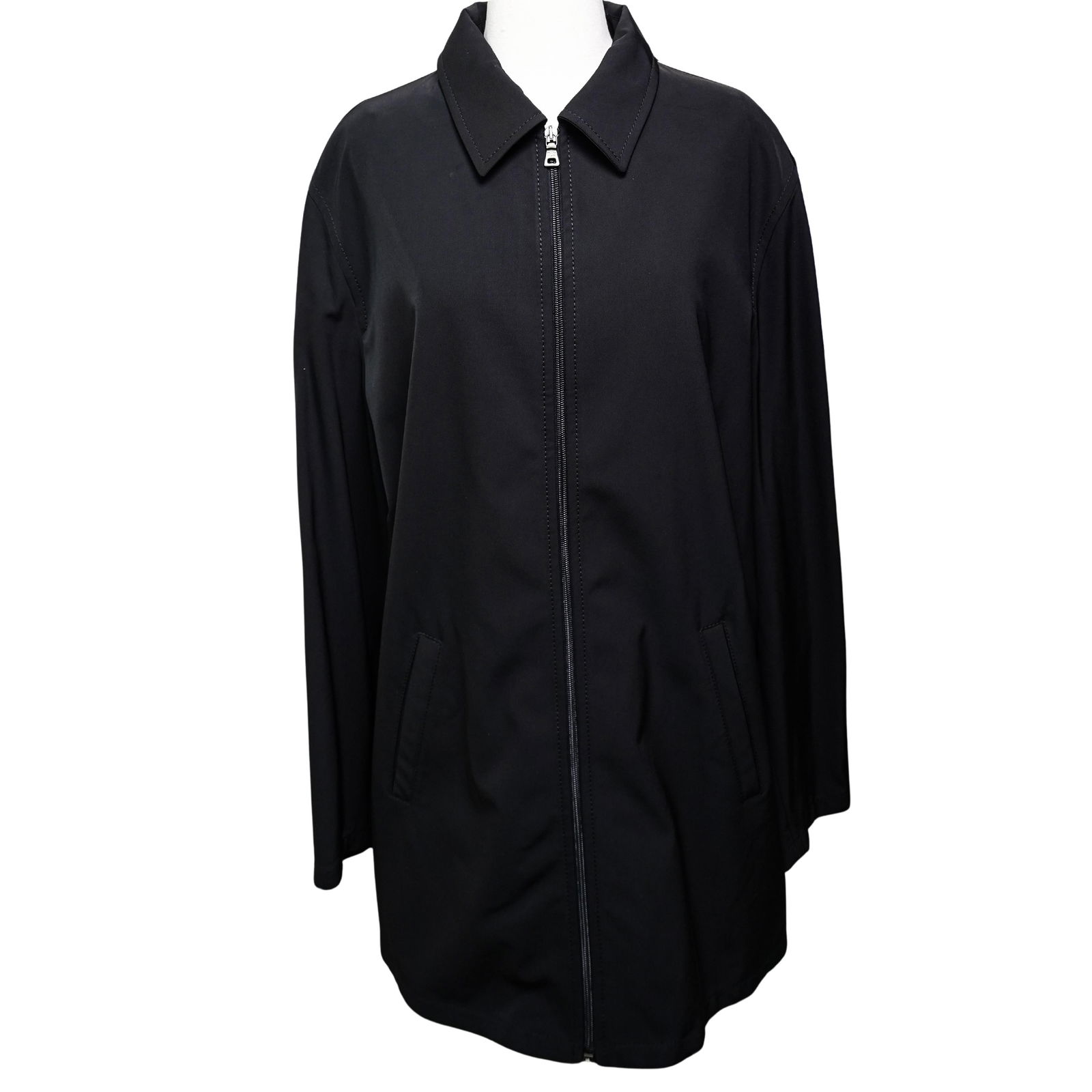 Prada Coat: Prada CoatItaly, 20th centuryPrada coat in 90% polyester material. Size XL. Marked "Prada made in Italy" on tag. Silver Prada double zipper.L 35" W (shoulders) 19" L (sleeve) 25" W (sleeve) 5 3/4"